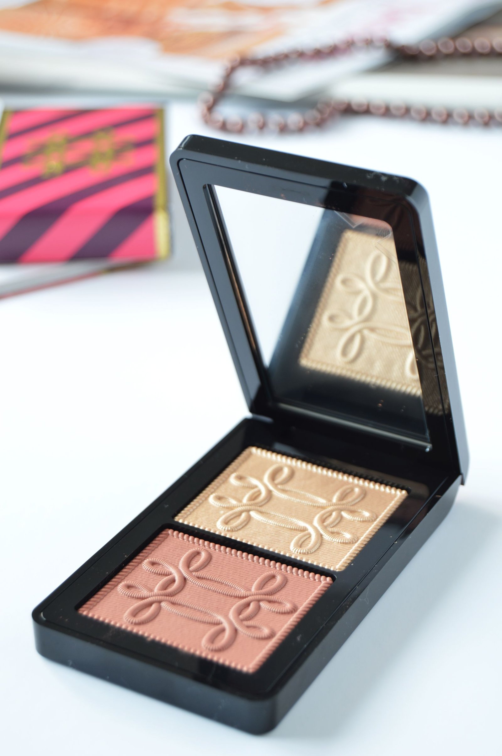 MAC Nutcracker Sweet Copper Face Compact contains Whisper of Gilt and Pleasure Model. Fuchsia&Burgundy packaging with gold embroidered accents is so festive and catchy. This is one of the holiday releases that you shouldn't miss out.